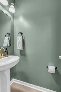 a bathroom with a sink and mirror