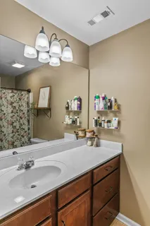 a bathroom with a sink and a mirror