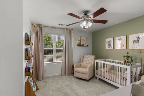 a bedroom with furniture and a window