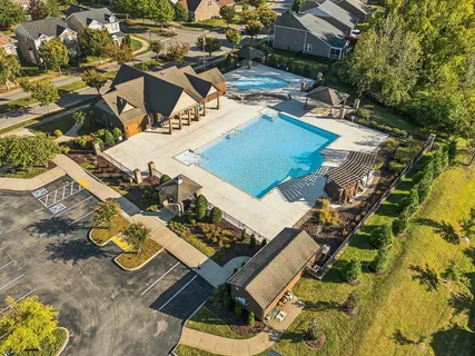 an aerial view of a house with swimming pool