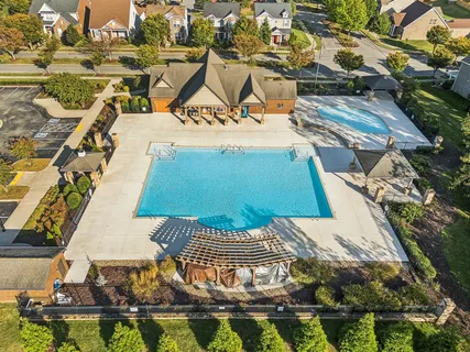 an aerial view of a house with swimming pool