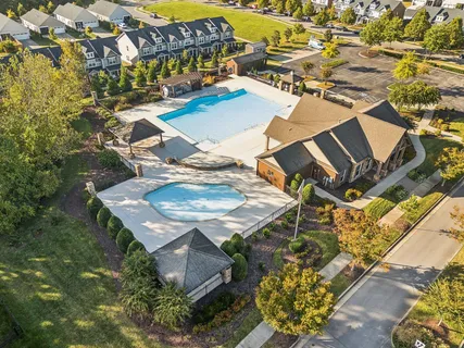 a view of a patio with table and chairs