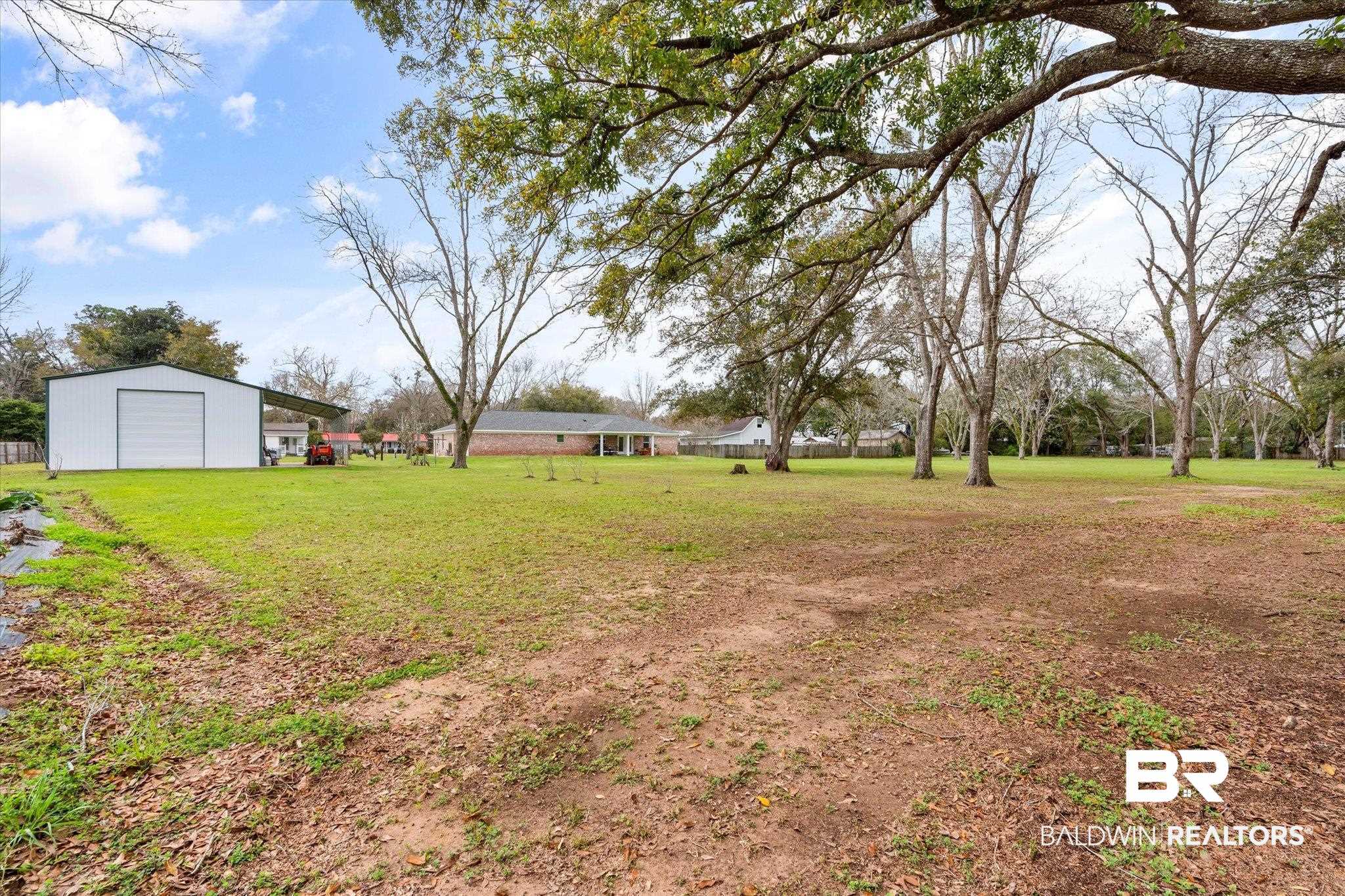 734 West Section Avenue Foley, AL 36535 - Photo 29 of 50 View of yard featuring an outbuilding