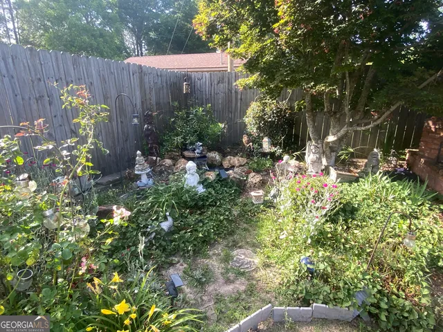 a backyard of a house with outdoor seating
