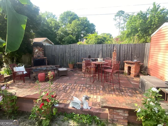 a backyard of a house with lots of green space and garden