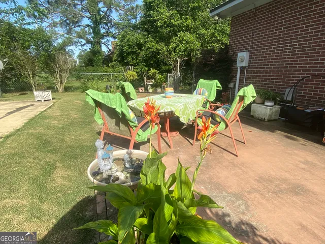 a view of a swimming pool with a patio
