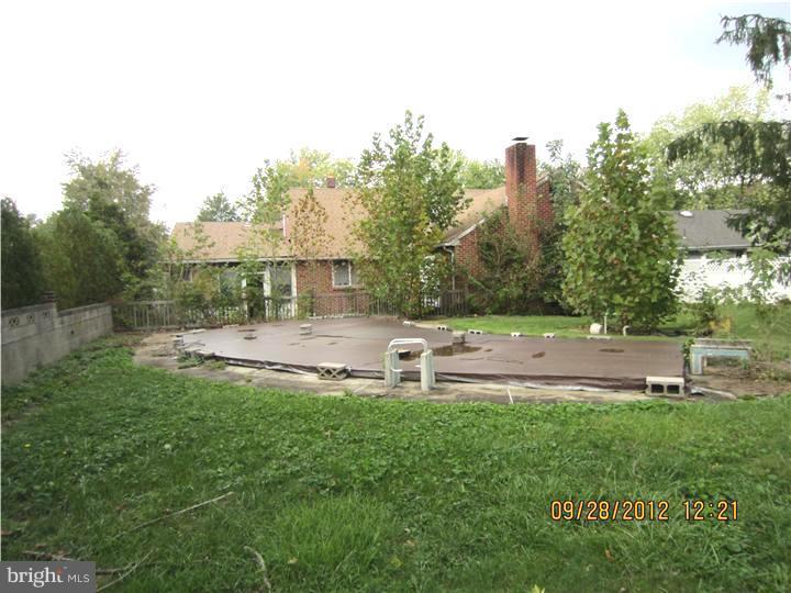 18 Randolph Road Woodbury, NJ 08096 - Photo 2 of 22 a view of a swimming pool with a patio