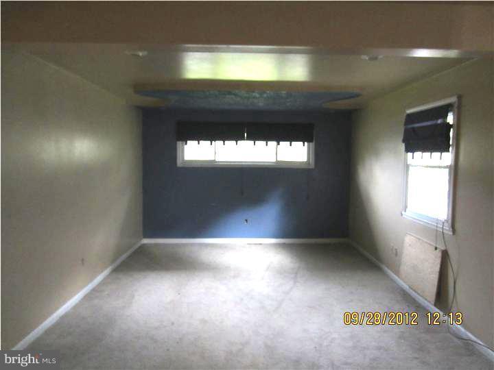 18 Randolph Road Woodbury, NJ 08096 - Photo 11 of 22 an empty room with windows and entrance