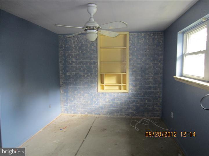 18 Randolph Road Woodbury, NJ 08096 - Photo 15 of 22 a bathroom with a window and a shower