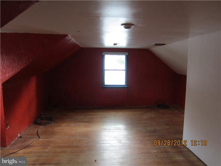18 Randolph Road Woodbury, NJ 08096 - Photo 17 of 22 an empty room with wooden floor and windows