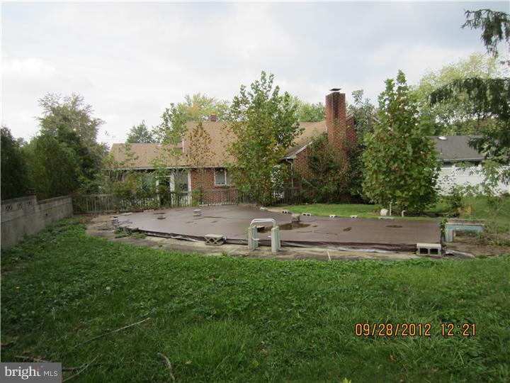 18 Randolph Road Woodbury, NJ 08096 - Photo 21 of 22 a view of house with backyard