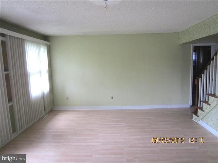 18 Randolph Road Woodbury, NJ 08096 - Photo 4 of 22 a view of an empty room and window