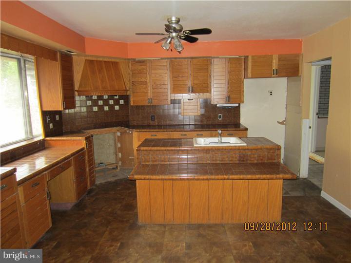 18 Randolph Road Woodbury, NJ 08096 - Photo 5 of 22 a view of a kitchen with a stove