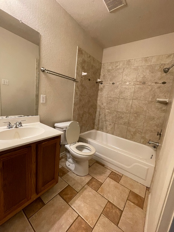 1212 Knoll Ridge Drive Cedar Park, TX 78613 - Photo 9 of 10 Bathroom featuring a textured wall, shower / washtub combination, vanity, and a textured ceiling