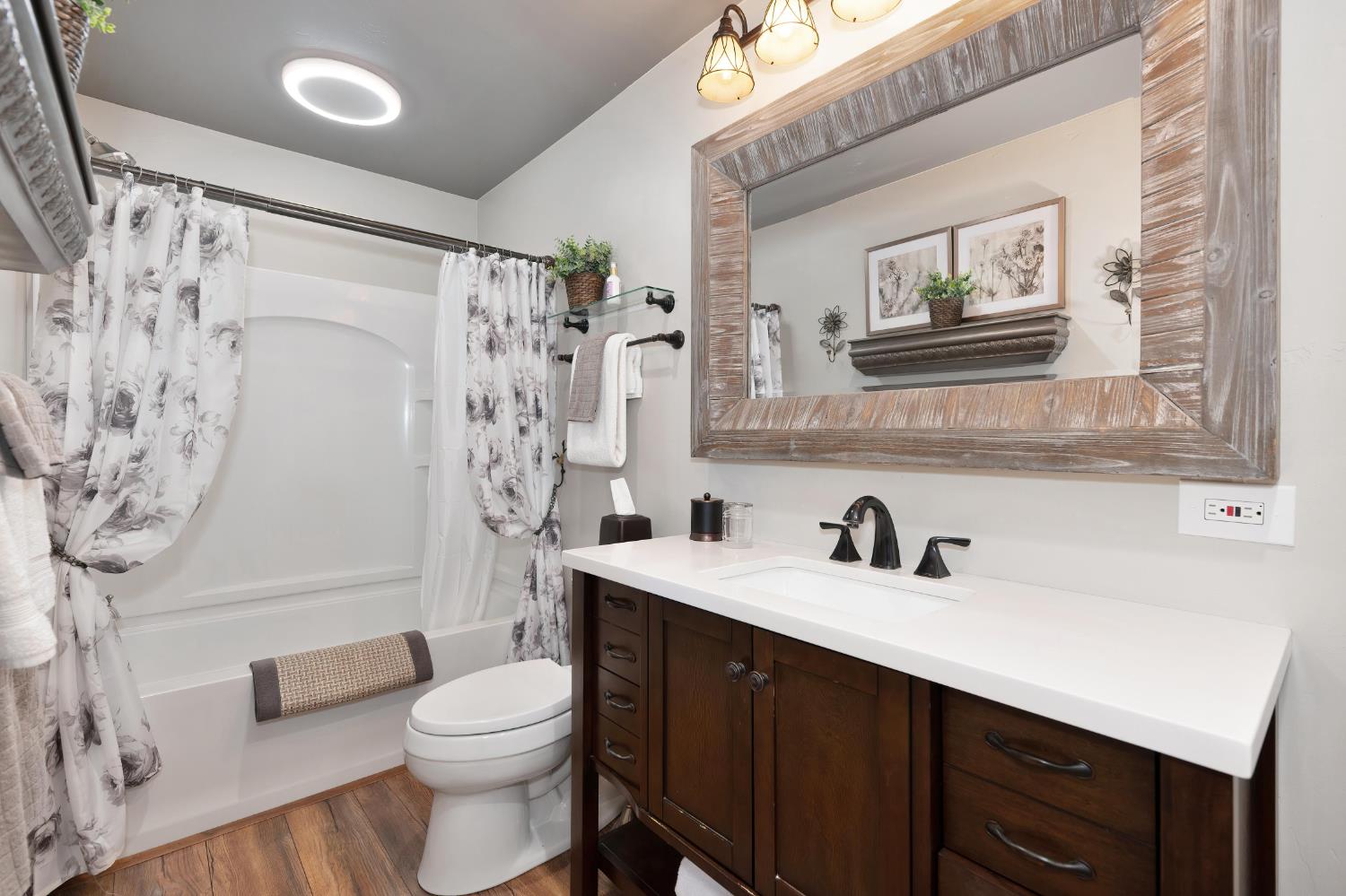 7333 Surette Lane Loomis, CA 95650 - Photo 32 of 42 a bathroom with a sink a toilet and shower
