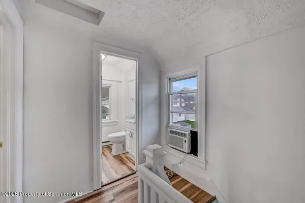 a room with furniture and wooden floor