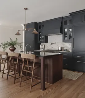 a kitchen with a table and chairs in it