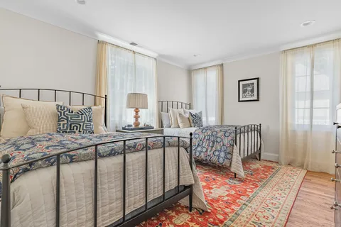 a bedroom with furniture and a window