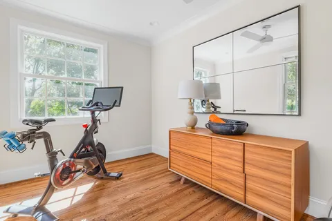 a room with a workspace and windows