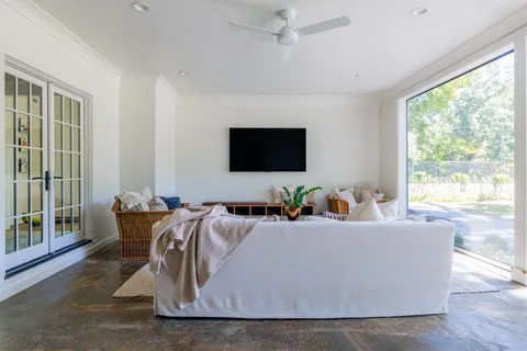 a living room with furniture and a flat screen tv
