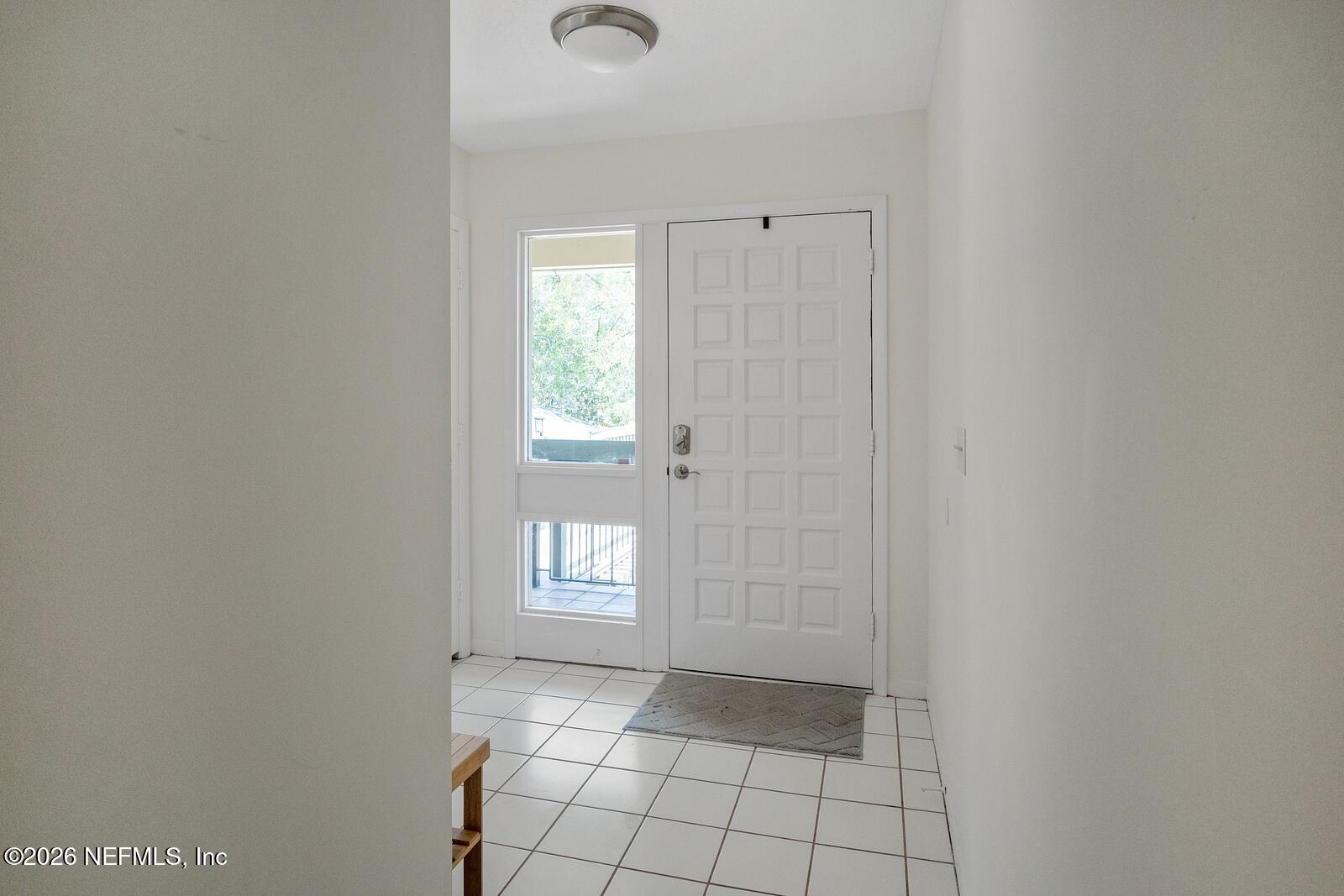 8012 Hollyridge Road, Unit 17U Jacksonville, FL 32256 - Photo 3 of 22 a view of an empty room and window