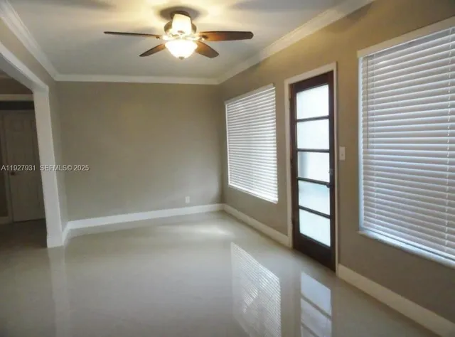 a view of empty room with windows