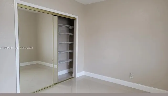 a view of an empty walk in closet