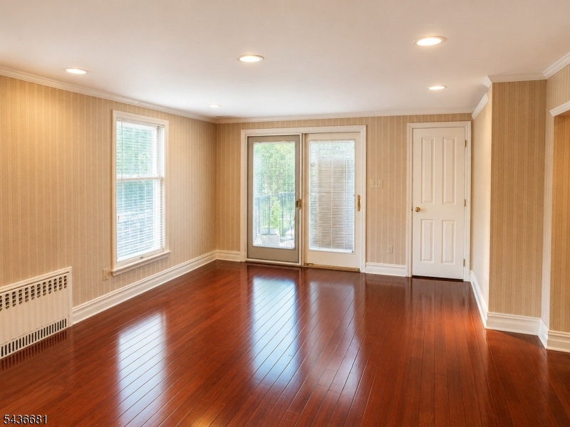 178 East Lindsley Road, Unit 2 Cedar Grove, NJ 07009 - Photo 7 of 28 a view of an empty room with wooden floor and a window