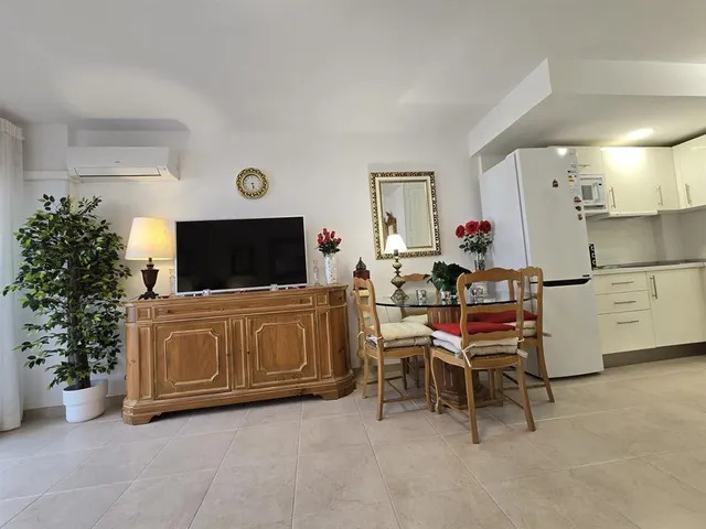 a bathroom with a shower and a sink