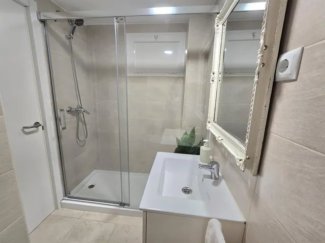 a bathroom with a sink and toilet