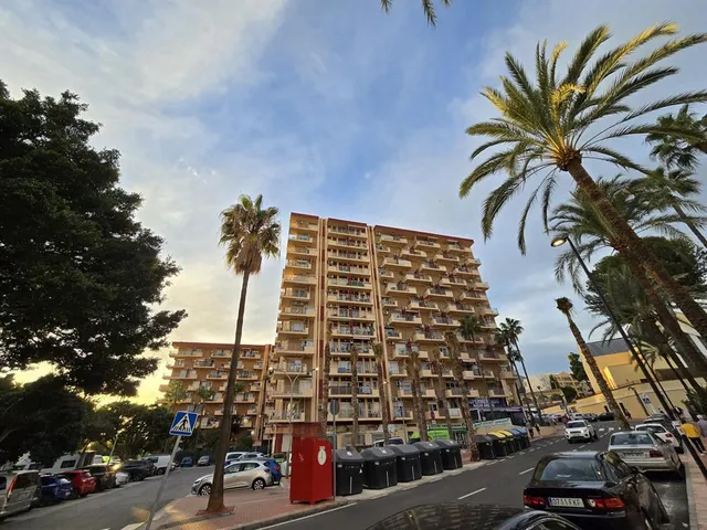 a view of a lake with a building in the background