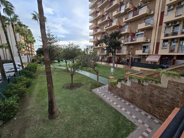 a view of swimming pool with outdoor seating