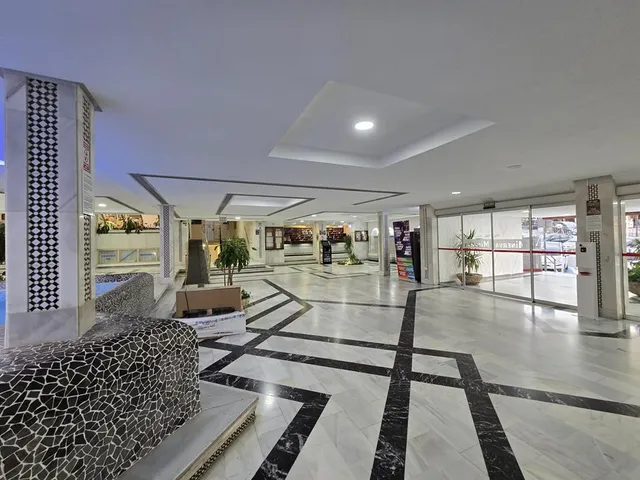 a view of empty room with closet and bathroom
