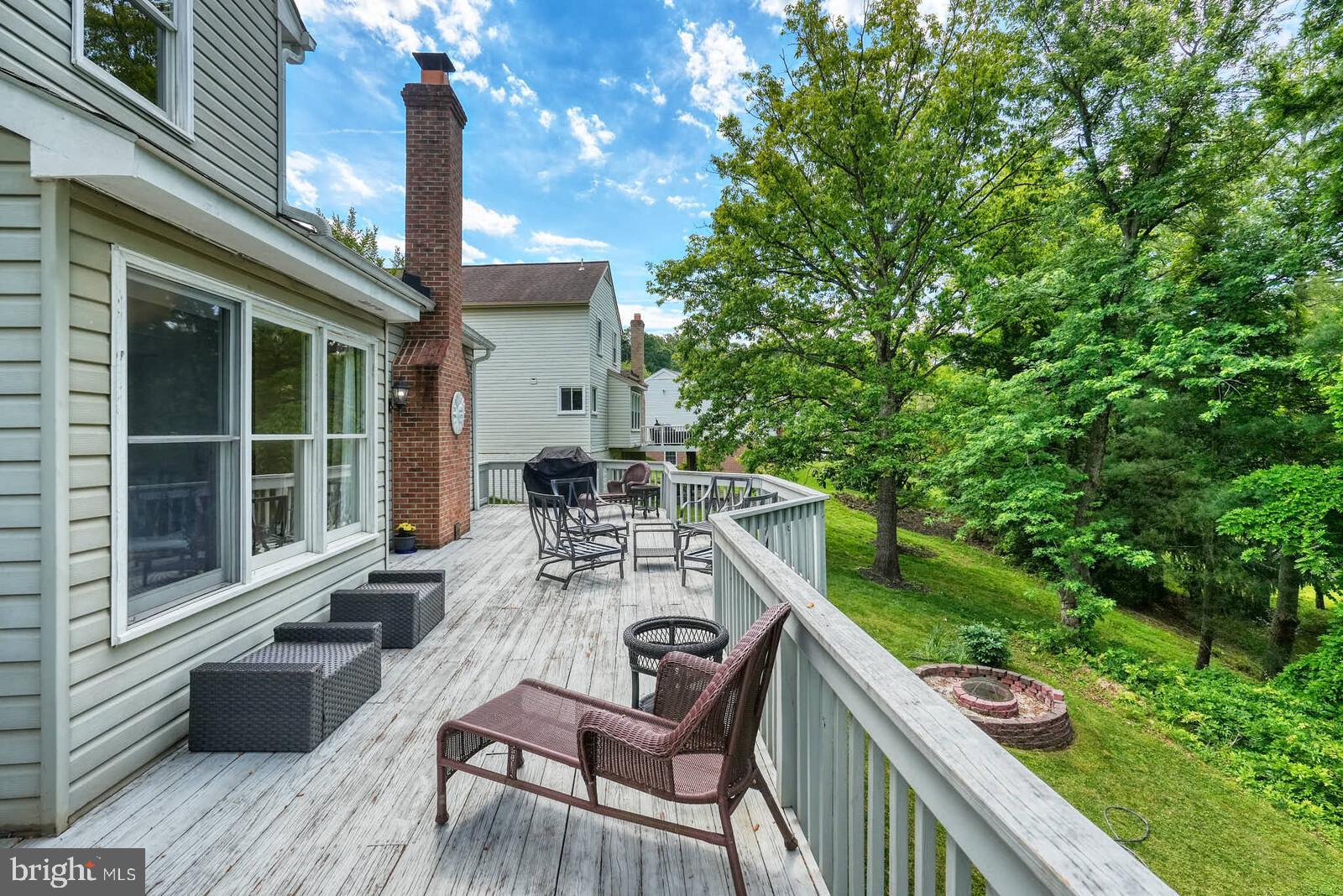 2108 Merrifields Drive Silver Spring, MD 20906 - Photo 56 of 69 a view of a patio with table and chairs with wooden floor and fence