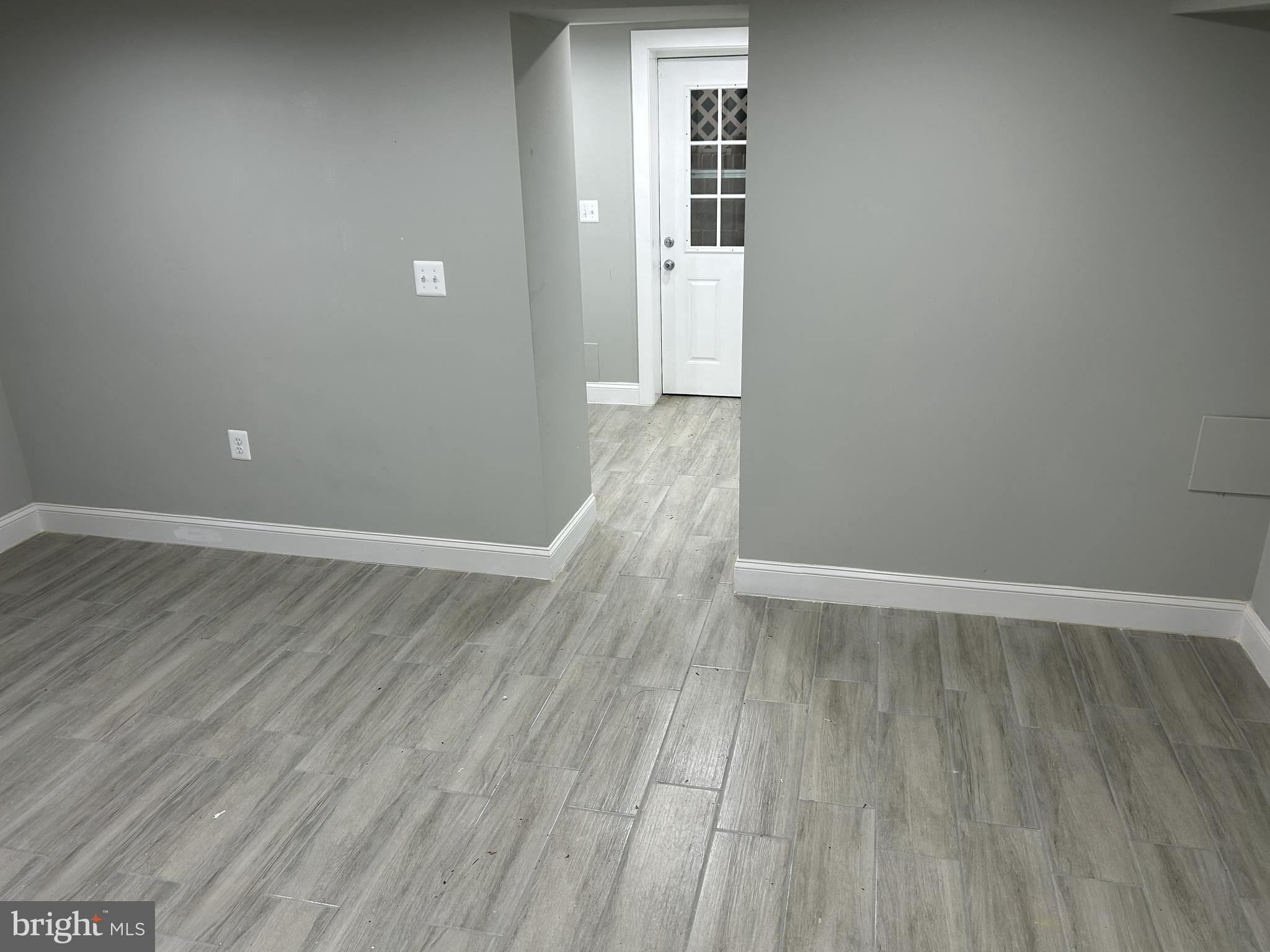 928 Perry Place Northeast Washington, DC 20017 - Photo 15 of 16 a view of wooden floor and windows in a room