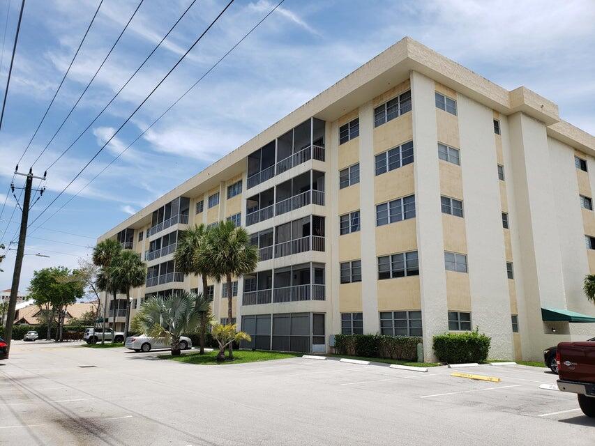 a front view of a building with street view