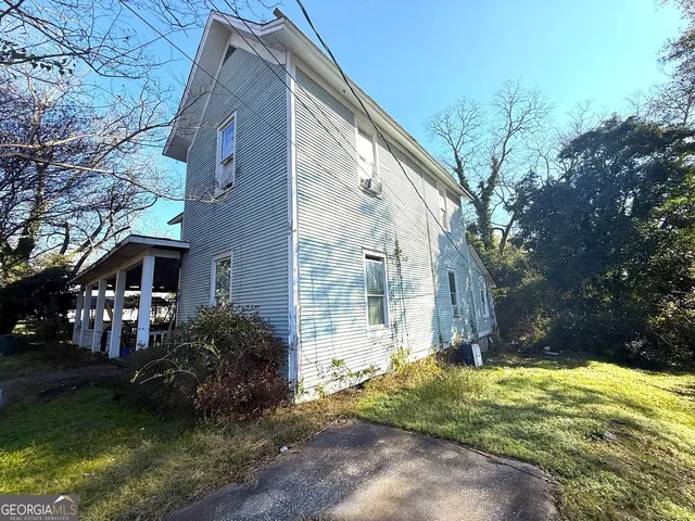 a backyard of a house with lots of green space