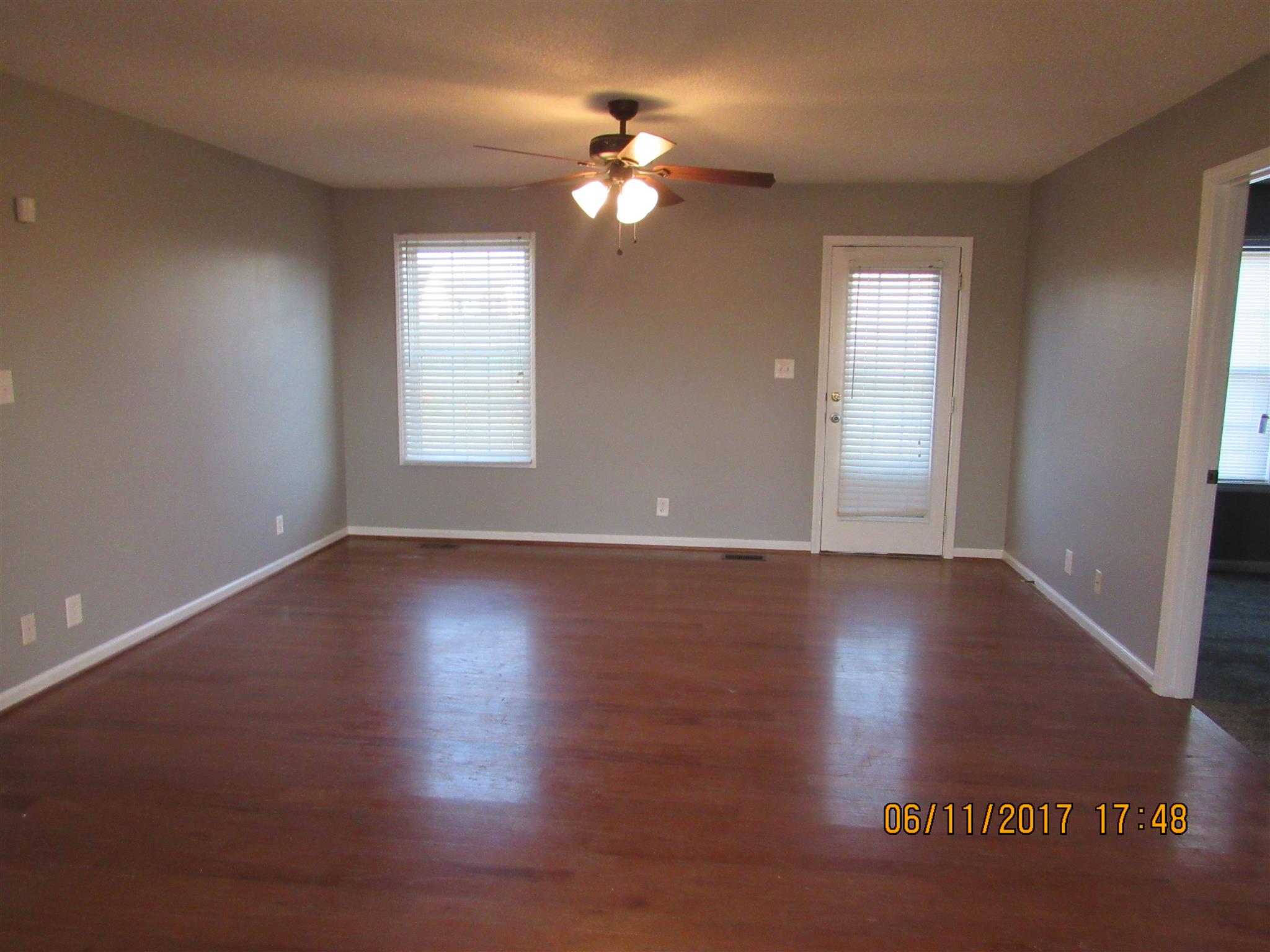211 Ruf Drive Oak Grove, KY 42262 - Photo 12 of 27 a view of a livingroom with wooden floor and a window