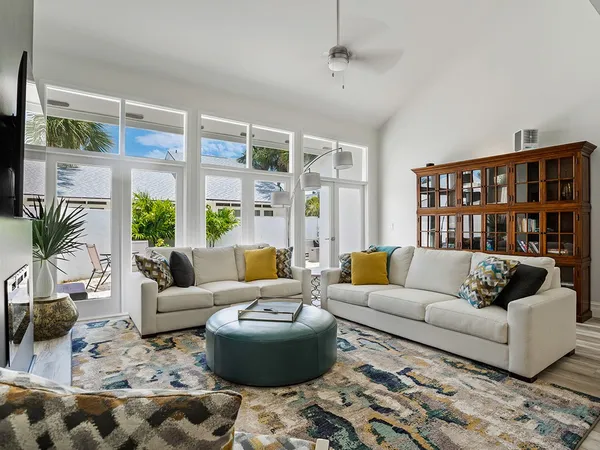 a living room with furniture or couch and a large window