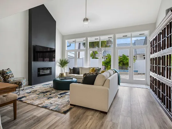 a living room with furniture fireplace and a flat screen tv