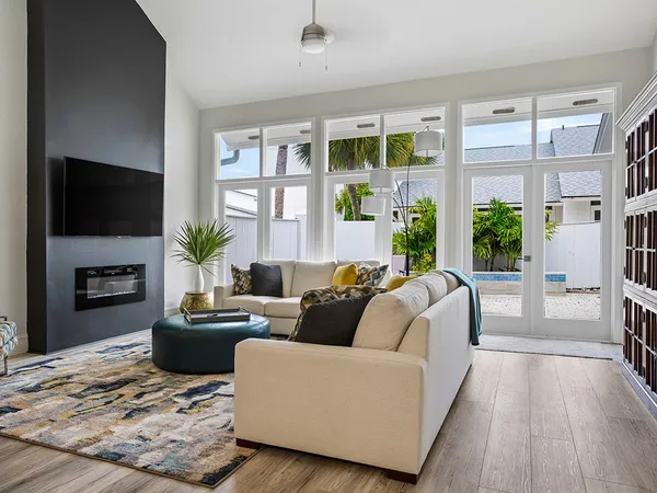 a living room with furniture fireplace and flat screen tv