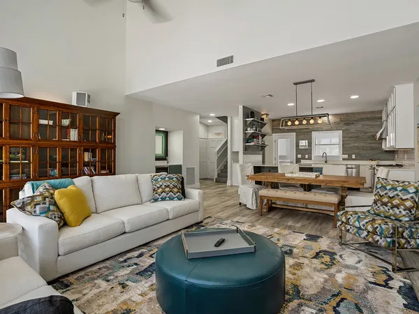 a living room with furniture and a rug