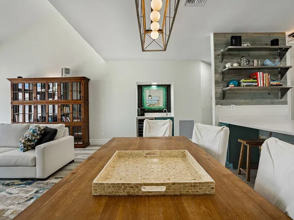 a living room with furniture fireplace and flat screen tv