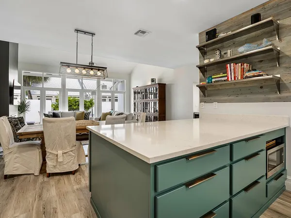 a room with furniture a air conditioner and a window