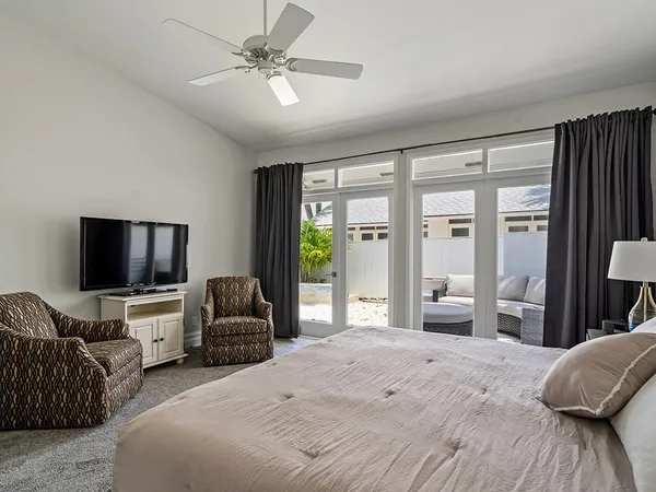 a bedroom with furniture and a flat screen tv