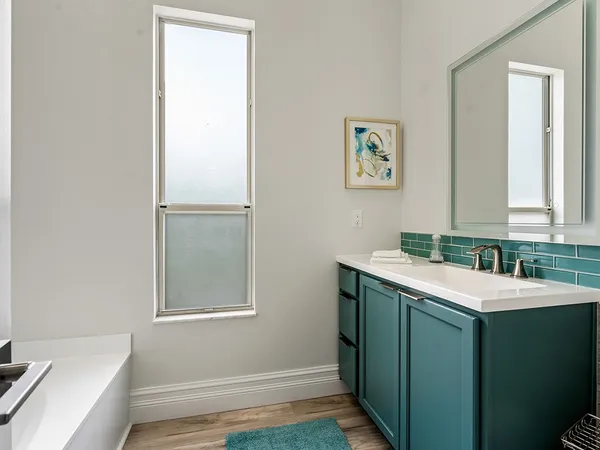 a bathroom with a sink and a mirror