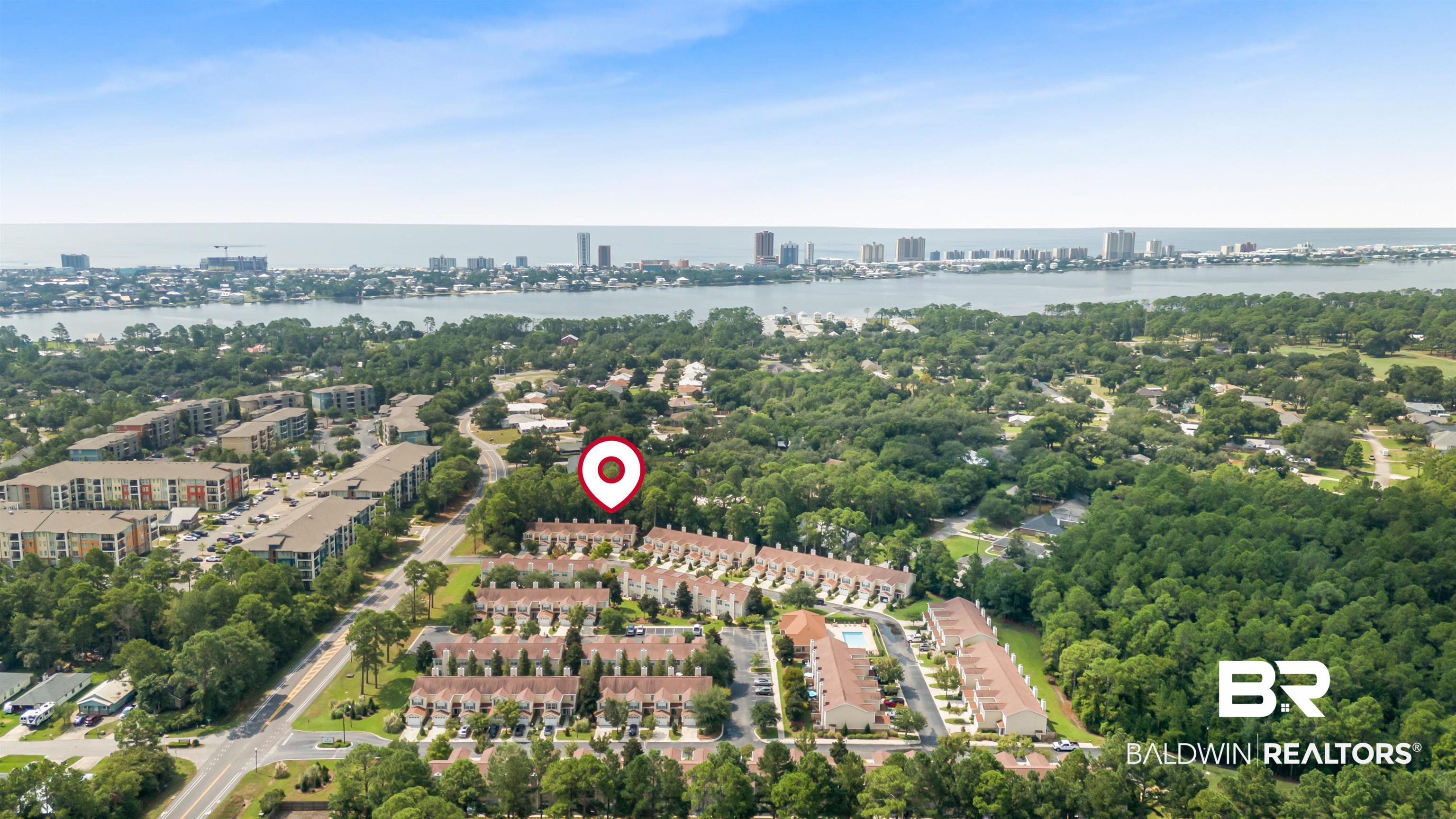 1517 Regency Road, Unit 85 Gulf Shores, AL 36542 - Photo 32 of 32 Drone / aerial view with a water view