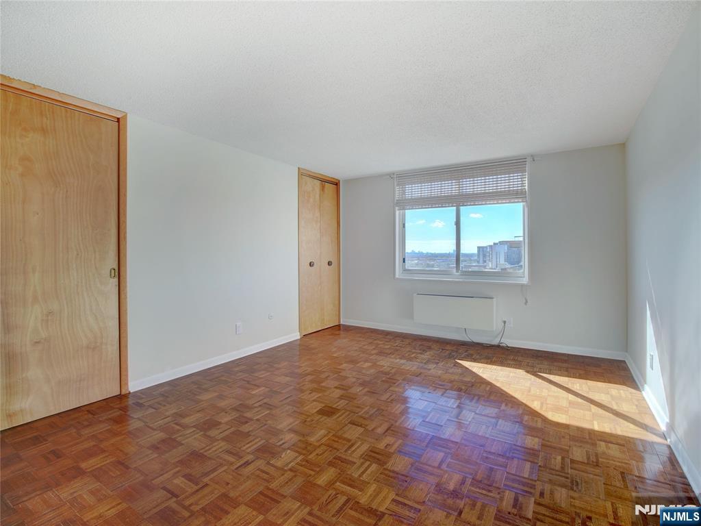 160 Overlook Avenue, Unit 17C Hackensack, NJ 07601 - Photo 12 of 30 an empty room with windows