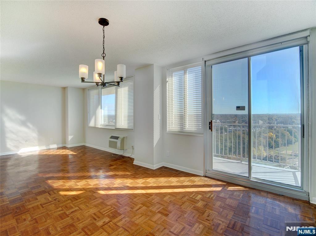 160 Overlook Avenue, Unit 17C Hackensack, NJ 07601 - Photo 17 of 30 a view of empty room with wooden floor and fan