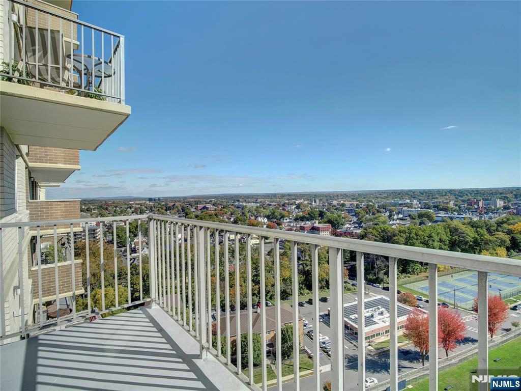 160 Overlook Avenue, Unit 17C Hackensack, NJ 07601 - Photo 18 of 30 a view of a balcony with wooden floor and fence